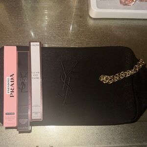 Brand new 3 piece 10 ml perfume set with YSL makeup bag